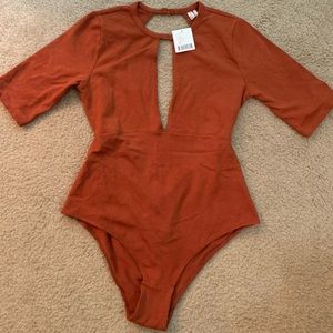 Urban Outfitter burnt orange bodysuit size M.
